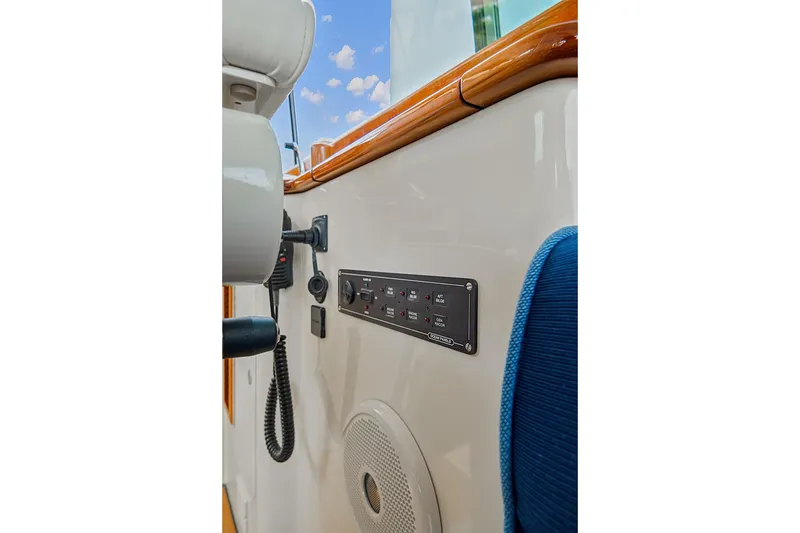 Slide: The Image of Control panel and speaker on 2018 Hinckley Picnic Boat 37 MKIII, featuring sleek design elements. - 34