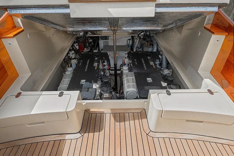 Slide: The Image of Engine compartment of 2018 Hinckley Picnic Boat 37 MKIII, showcasing dual engines and clean design. - 48