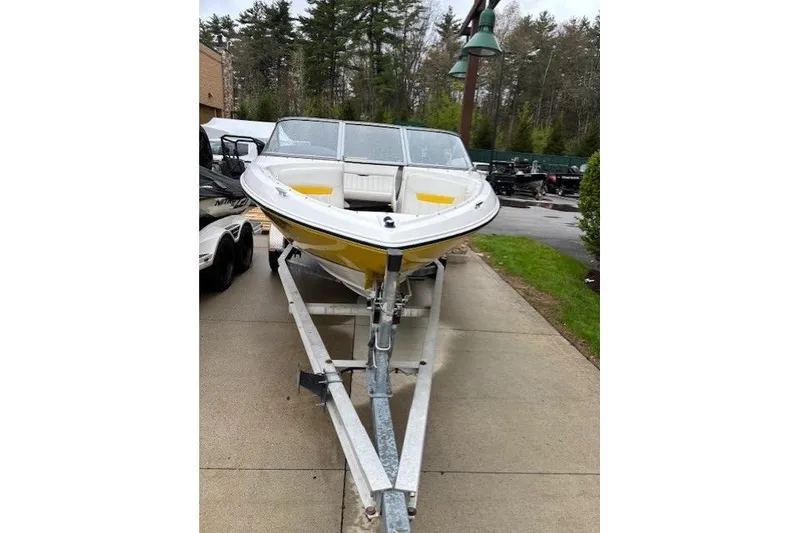 Slide: The Image of 2008 Regal 1900 Bowrider boat on trailer, parked outdoors. - 2