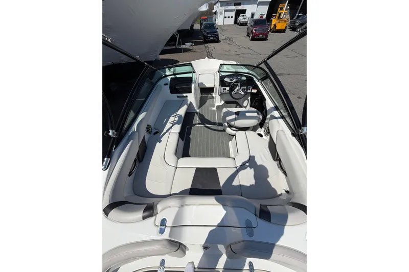 Slide: The Image of 2014 Yamaha Boats SX192 interior with sleek seating and modern dashboard. - 12