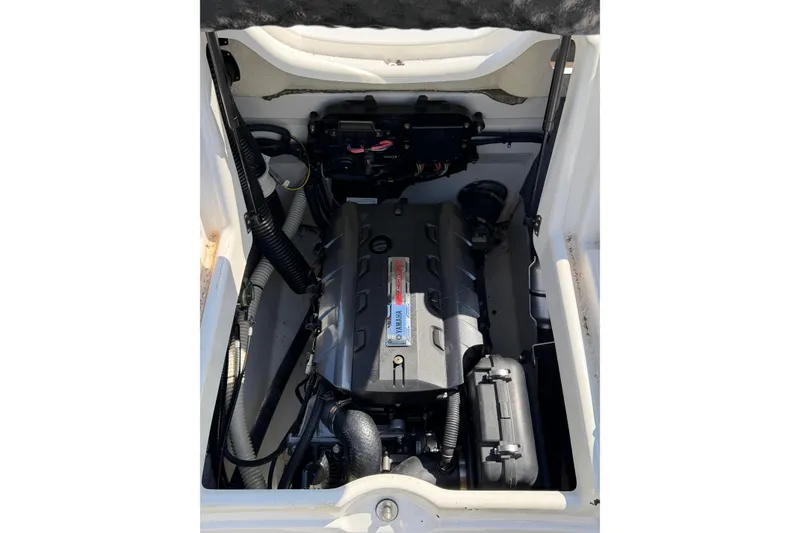 Slide: The Image of 2014 Yamaha Boats SX192 engine compartment, showcasing clean and well-maintained components. - 16