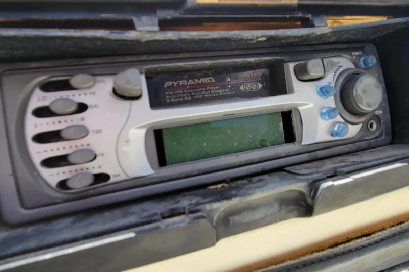 Slide: The Image of Close-up of a vintage Pyramid AM/FM cassette player in a 2003 Odyssey Millennium. - 17