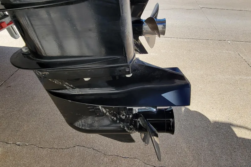 Slide: The Image of Close-up of a 2003 Odyssey Millennium boat motor with dual propellers. - 7