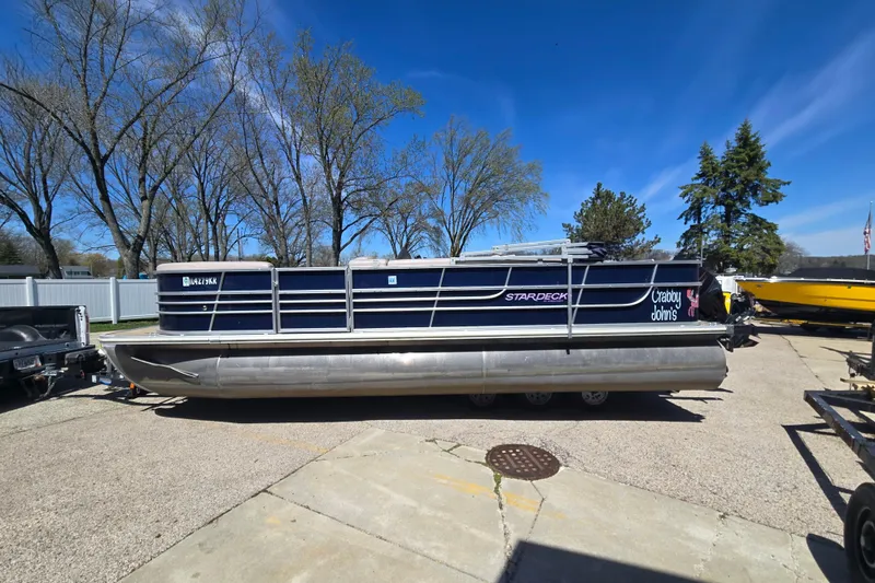 The Image of 2013 Starcraft Stardeck 236 Cruise-N-Fish pontoon boat parked outdoors. - 0