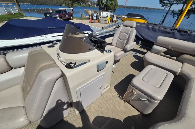 Slide: The Image of 2013 Starcraft Stardeck 236 Cruise-N-Fish pontoon boat interior with seating and helm. - 10