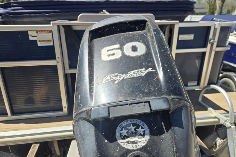Slide: The Image of Outboard motor on 2013 Starcraft Stardeck 236 Cruise-N-Fish boat, featuring 60 horsepower. - 12