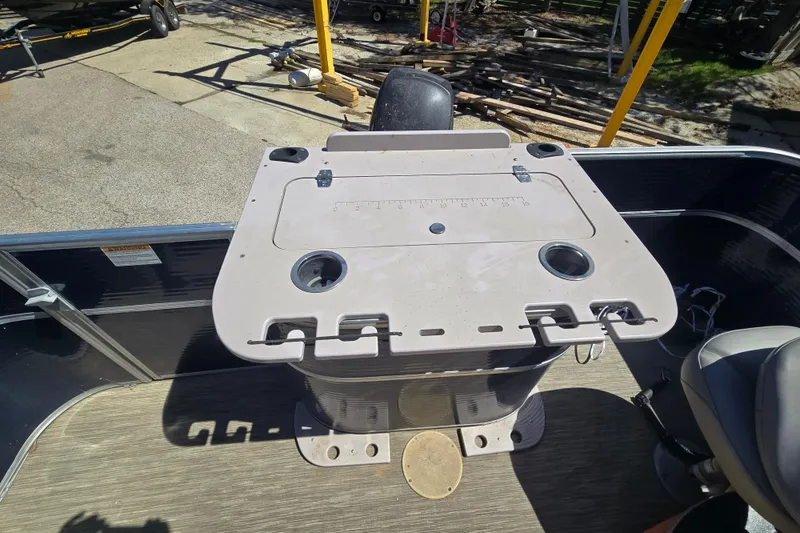 Slide: The Image of 2013 Starcraft Stardeck 236 Cruise-N-Fish boat deck with fishing station and cup holders. - 13
