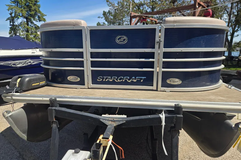 Slide: The Image of 2013 Starcraft Stardeck 236 Cruise-N-Fish pontoon boat on trailer, parked outdoors. - 5