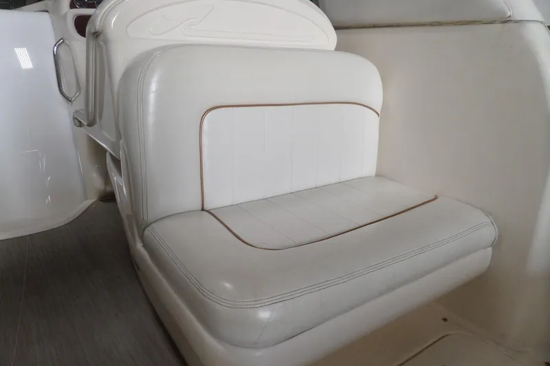 Slide: The Image of White leather seating on 1997 Sea Ray 290 Sundancer boat interior. - 10