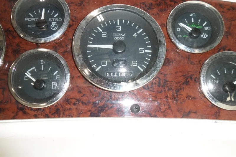 Slide: The Image of Dashboard gauges of a 1997 Sea Ray 290 Sundancer boat. - 20