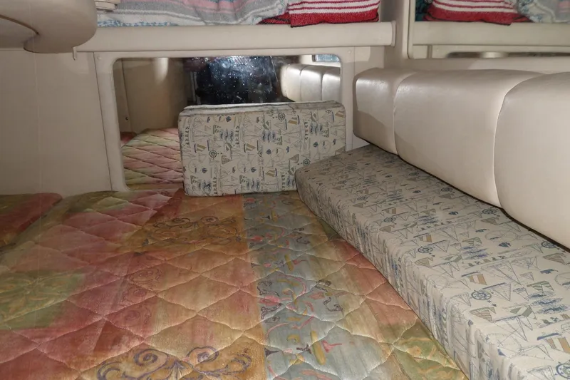 Slide: The Image of Interior cabin of 1997 Sea Ray 290 Sundancer with colorful patterned upholstery. - 36