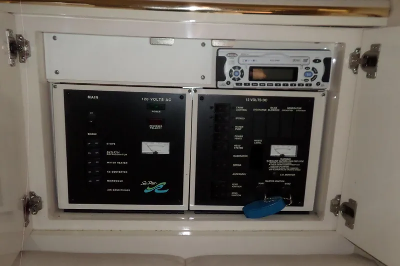 Slide: The Image of Electrical panel and stereo system on a 1997 Sea Ray 290 Sundancer boat. - 39