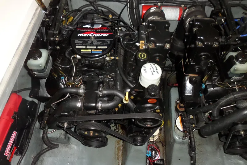Slide: The Image of Engine compartment of a 1997 Sea Ray 290 Sundancer with MerCruiser components. - 46