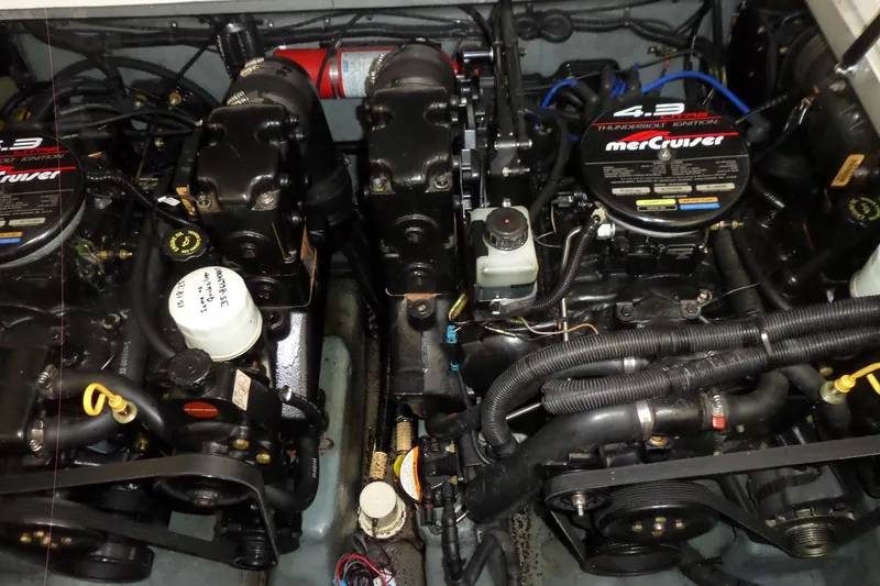 Slide: The Image of Engine compartment of a 1997 Sea Ray 290 Sundancer with MerCruiser engines. - 47
