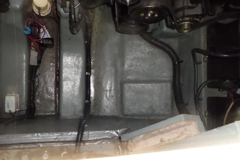 Slide: The Image of Engine compartment of a 1997 Sea Ray 290 Sundancer boat, showing wiring and components. - 50