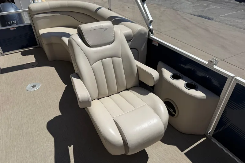 Slide: The Image of 2017 Bennington SX 22 Quad Bench boat interior with beige seating and cup holders. - 11