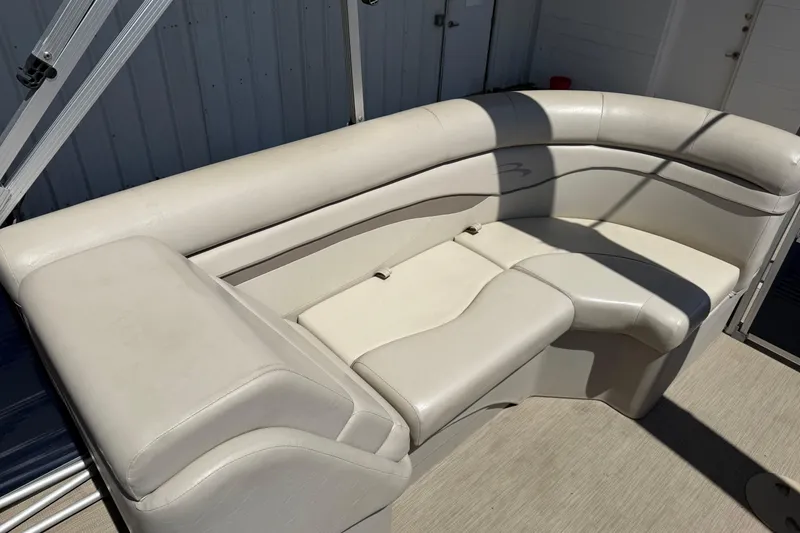 Slide: The Image of 2017 Bennington SX 22 Quad Bench with beige upholstery in a boat interior. - 14