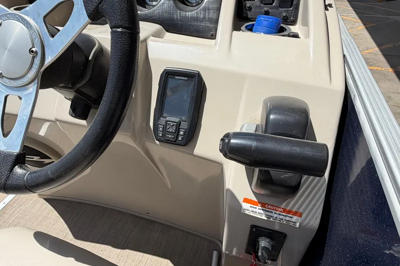 Slide: The Image of Steering console of a 2017 Bennington SX 22 Quad Bench boat with Garmin device. - 16