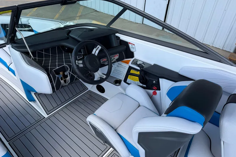 Slide: The Image of 2019 Nautique Super Air Nautique GS22 boat interior with modern dashboard and seating. - 11