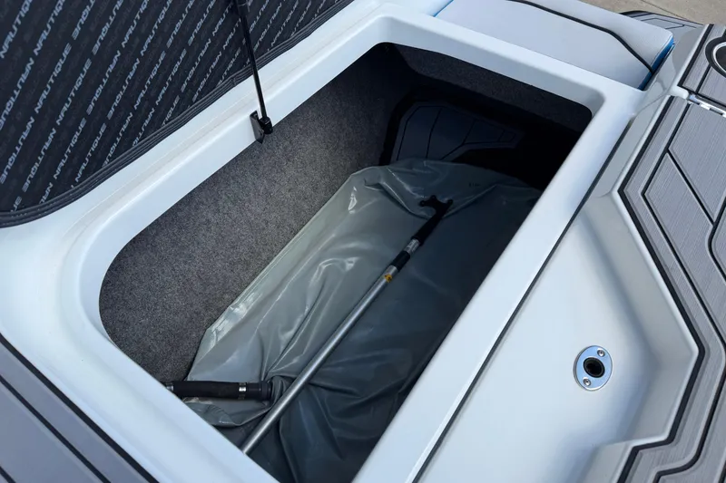 Slide: The Image of Storage compartment of 2019 Nautique Super Air Nautique GS22 boat. - 16
