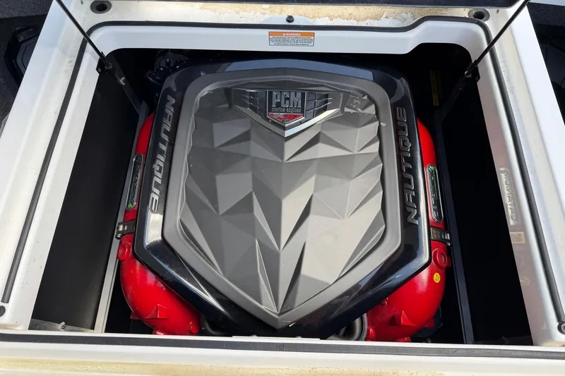 Slide: The Image of 2019 Nautique Super Air Nautique GS22 engine compartment with PCM engine cover. - 17