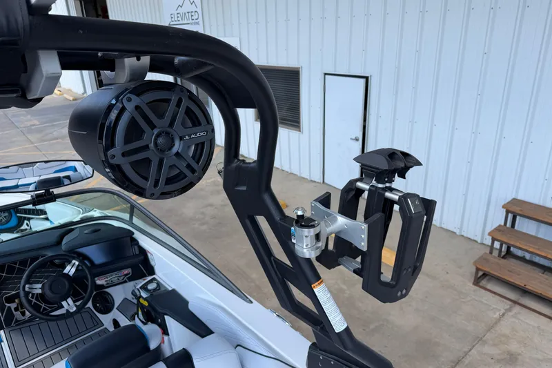 Slide: The Image of 2019 Nautique Super Air Nautique GS22 with JL Audio speaker and wakeboard rack. - 18