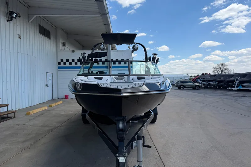 Slide: The Image of 2019 Nautique Super Air Nautique GS22 boat on trailer at dealership. - 8