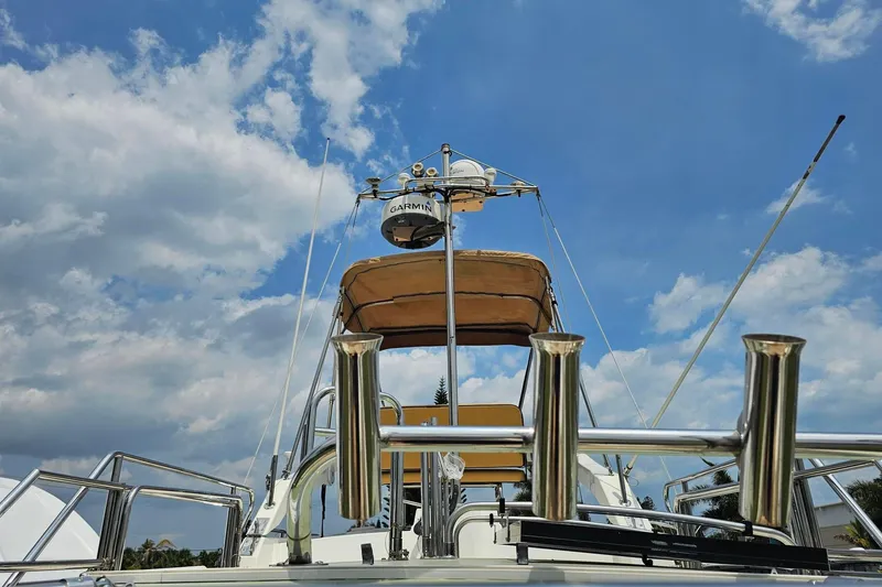 Slide: The Image of 2014 Ranger Tugs R-31 CB boat with radar equipment against a cloudy sky. - 1