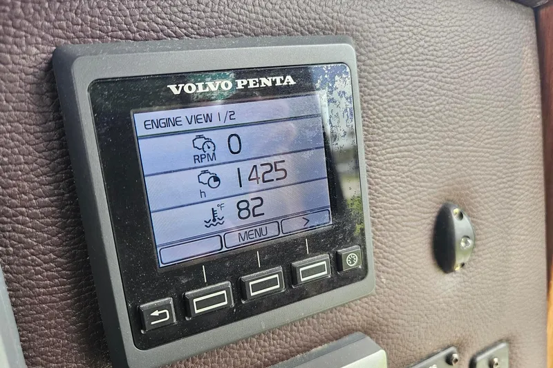 Slide: The Image of Volvo Penta engine display on 2014 Ranger Tugs R-31 CB, showing RPM and temperature. - 12