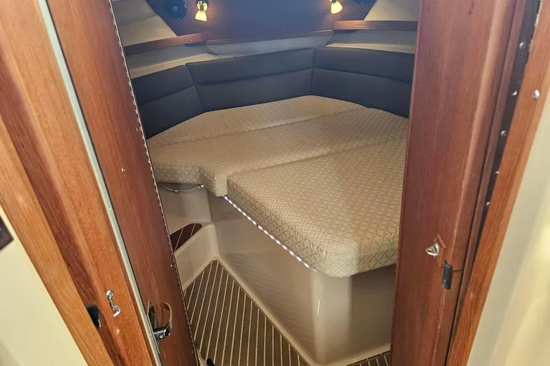Slide: The Image of Cozy cabin interior of 2014 Ranger Tugs R-31 CB with comfortable bedding. - 15