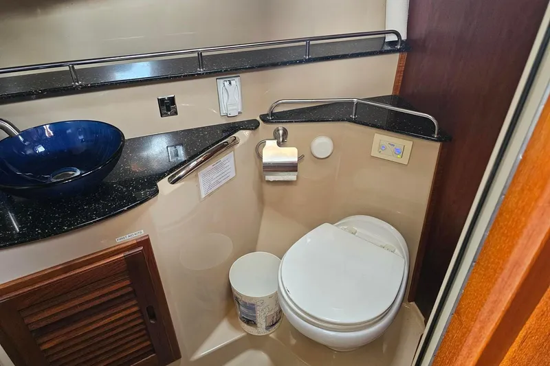Slide: The Image of 2014 Ranger Tugs R-31 CB bathroom with modern sink and toilet. - 17