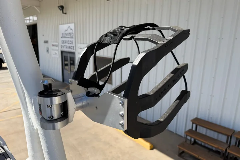 Slide: The Image of 2025 Nautique Super Air Nautique GS24 wakeboard rack, mounted on a boat, near service entrance. - 21