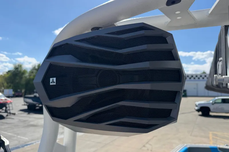 Slide: The Image of 2025 Nautique Super Air Nautique GS24 boat speaker, outdoor setting, clear sky. - 22