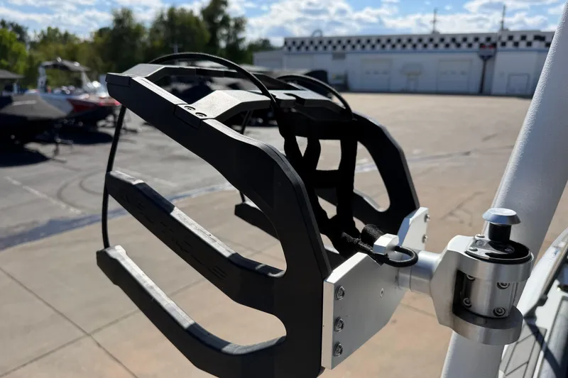 Slide: The Image of 2025 Nautique Super Air Nautique GS24 wakeboard rack in a sunny outdoor setting. - 23