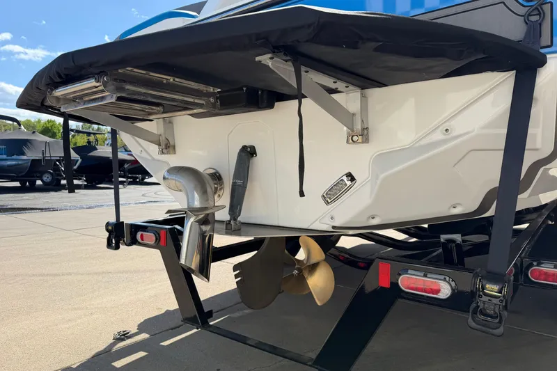 Slide: The Image of 2025 Nautique Super Air Nautique GS24 boat stern with propeller and exhaust system. - 5