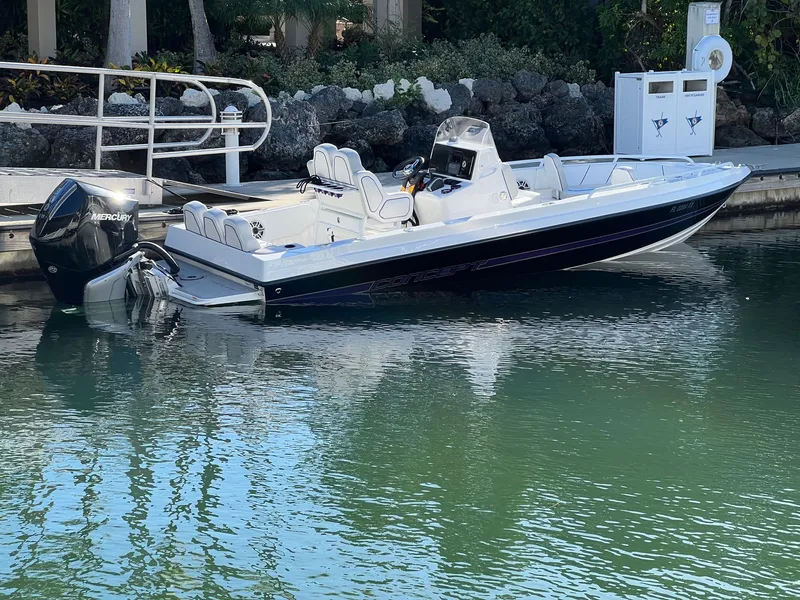 Slide: The Image of 2025 Concept 23 boat docked with Mercury outboard motor. - 1