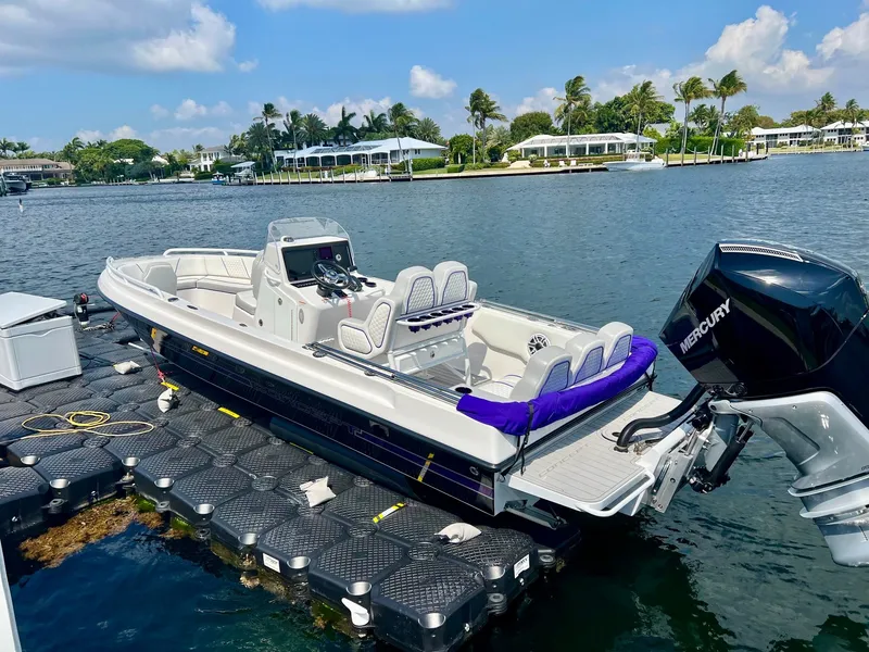 Slide: The Image of Luxurious Concept 23 boat from 2025 docked with Mercury engine. - 11