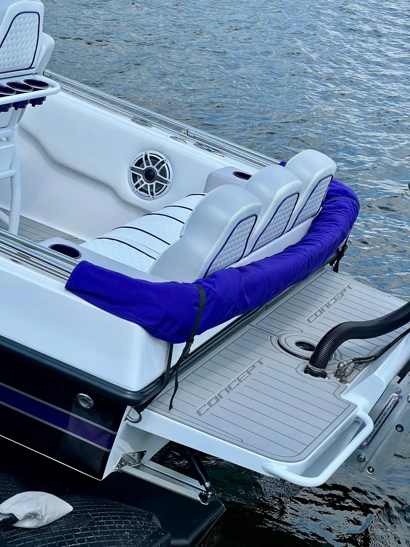 Slide: The Image of Luxury Concept 23 boat, 2025 model, featuring stylish seating by the water. - 13