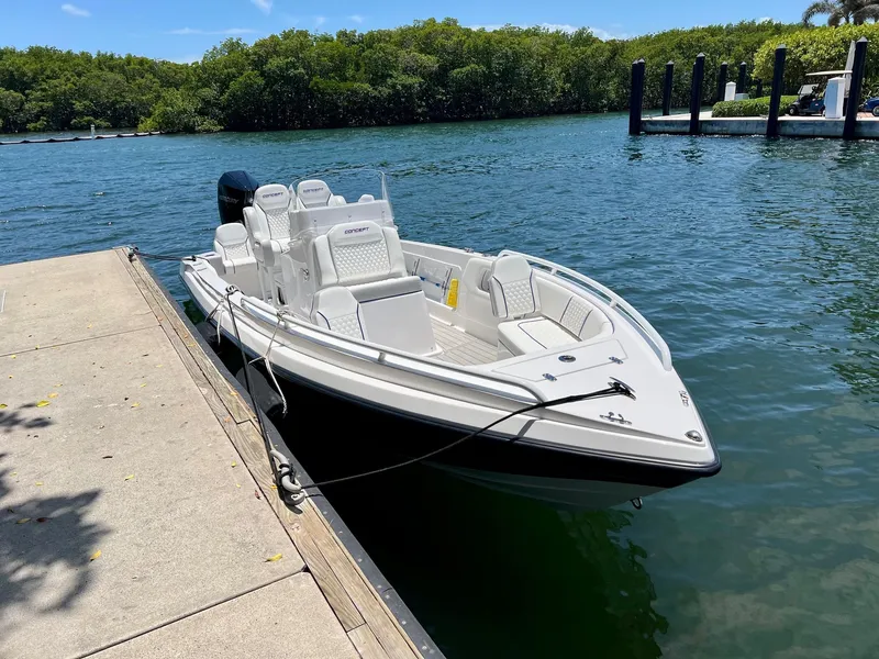 Slide: The Image of 2025 Concept 23 boat docked on a sunny day. - 2
