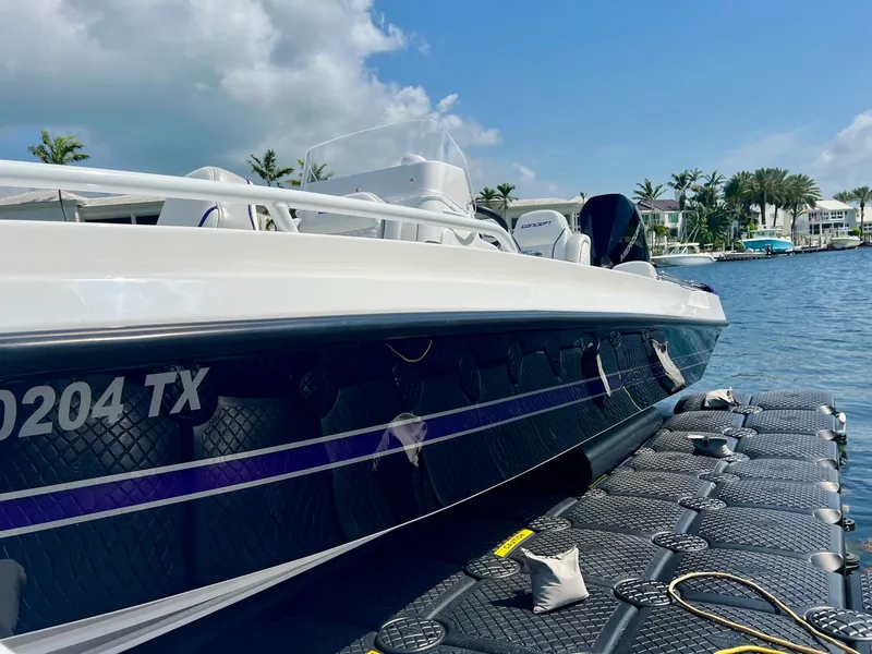 Slide: The Image of 2025 Concept 23 boat docked with blue sky backdrop. - 6