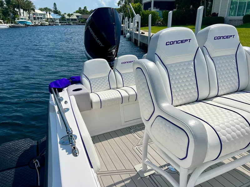 Slide: The Image of Luxurious 2025 Concept 23 boat with white seats by the water. - 7