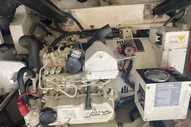 Slide: The Image of Engine compartment of a 2009 Cabo 35 Express boat, showcasing mechanical components. - 7