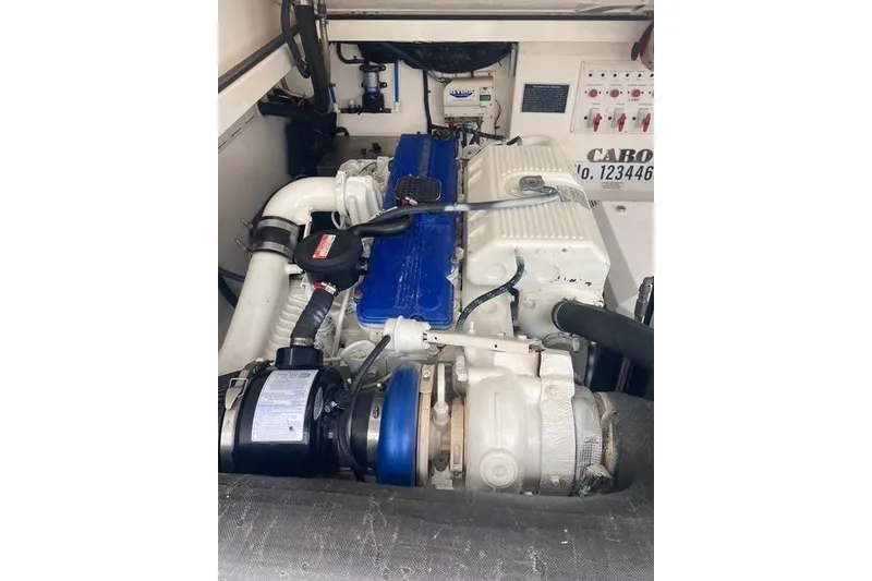 Slide: The Image of Engine compartment of a 2009 Cabo 35 Express boat, showcasing detailed machinery. - 8