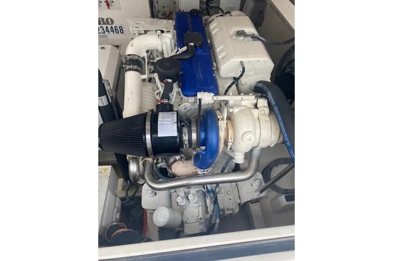 Slide: The Image of Engine of 2009 Cabo 35 Express boat, featuring blue and white components. - 9