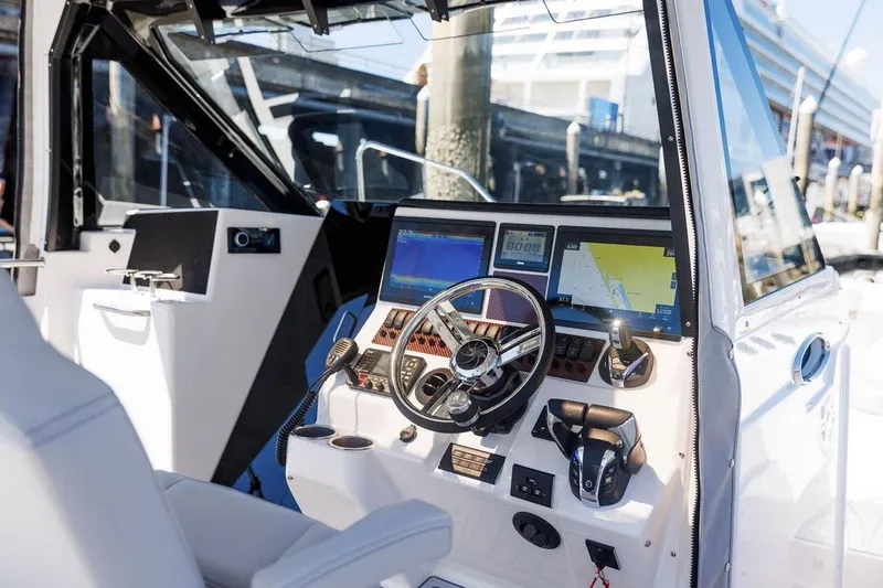 Slide: The Image of Manufacturer Provided Image: 2025 Solara S-310 CW boat cockpit with advanced navigation and control systems. - 17