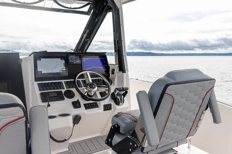 Slide: The Image of Manufacturer Provided Image: 2025 Solara S-310 CW boat cockpit with modern navigation system and comfortable seating. - 18