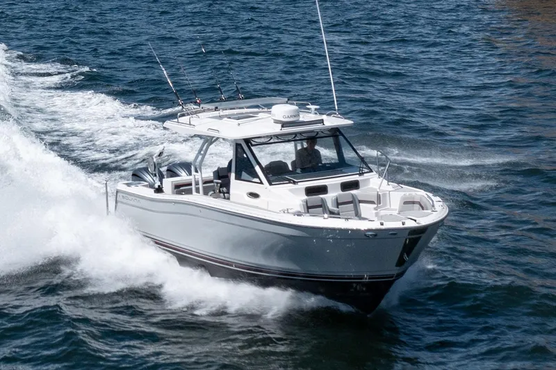 Slide: The Image of Manufacturer Provided Image: 2025 Solara S-310 CW boat cruising on open water. - 6