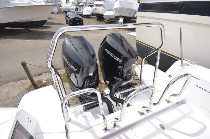 Slide: The Image of 2024 Axopar 37 XC Cross Cabin with dual Mercury outboard engines. - 13