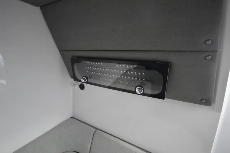 Slide: The Image of 2024 Axopar 37 XC Cross Cabin interior control panel detail. - 33