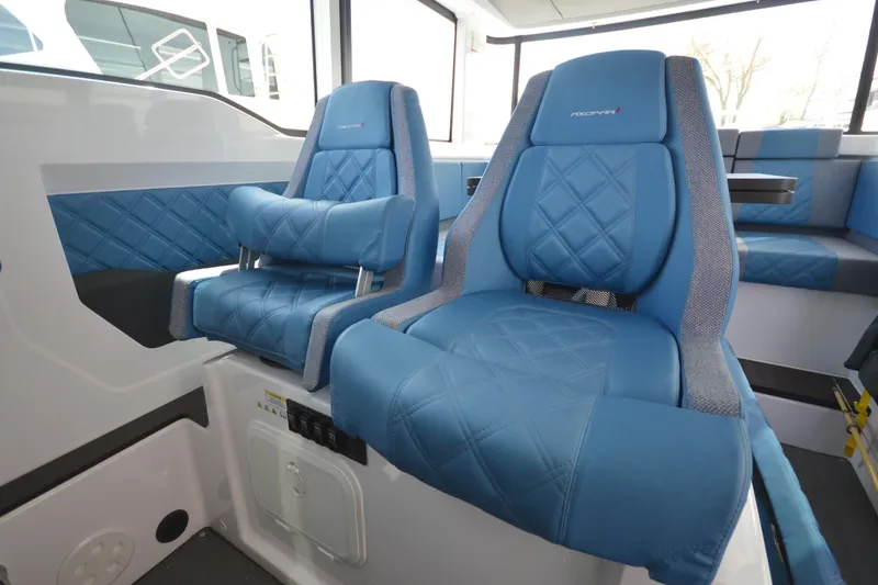 Slide: The Image of Luxurious blue seating in 2024 Axopar 37 XC Cross Cabin boat interior. - 39